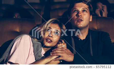 People audience watching movie in cinema theater. 65795112