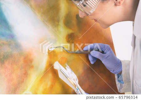 Artwork conservator at work 65796314