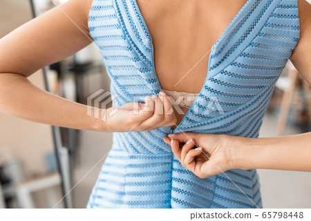 Unrecognizable Lady Zipping Up Too-Tight Dress Indoors, Cropped, Rear View 65798448