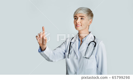 Doctor hand touching empty virtual screen. Friendly woman and modern technology 65799298