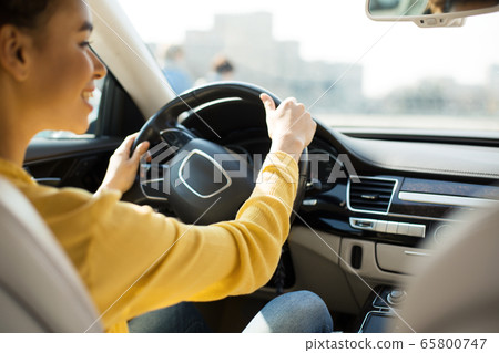 Happy Female Driver Driving Car Having Ride In City Happy Female Driver Driving Car Having Ride In City 65800747