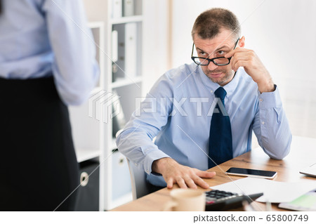 Mature Boss Seducing Young Employee Woman In Modern Office, Cropped Mature Boss Seducing Young Employee Woman In Modern Office, Cropped 65800749