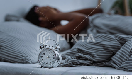 African american woman suffering from insomnia lying in bed without sleep. 65801142