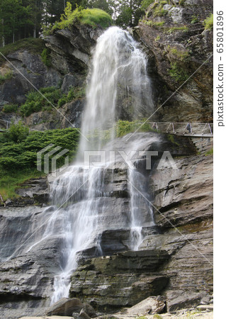 A panoramic view of the Stendhal waterfall on the path from Bergen to Hardangerfjord, Norway A panoramic view of the Stendhal waterfall on the path from Bergen to Hardangerfjord, Norway 65801896