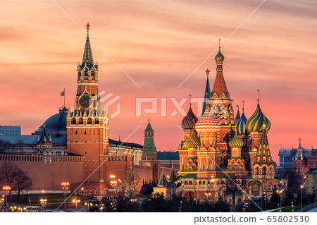St. Basil's Cathedral and the Spassky Tower of the Moscow Kremlin at sunset 65802530