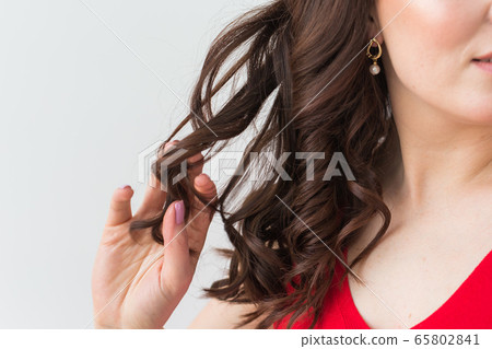 Close-up of woman wearing a Jewelry, bijouterie and accessories. Close-up of woman wearing a Jewelry, bijouterie and accessories. 65802841