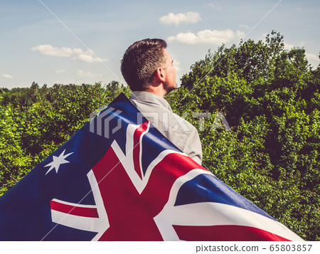 Attractive man holding Australian Flag. National 65803857