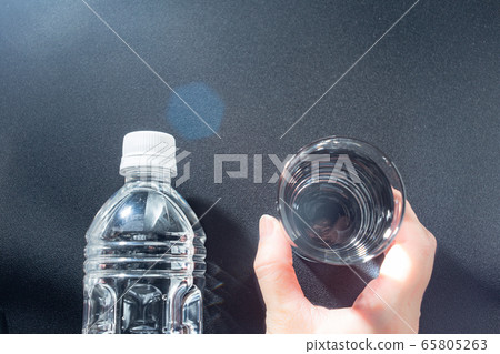 Water and plastic bottle. Hydration. Health/sports and training. Heat stroke measures etc. 65805263