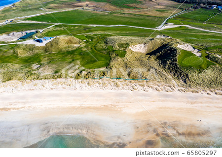 Aerial view of Carrickfad and Cashelgolan beach, Castlegoland, by Portnoo in County Donegal - Ireland Aerial view of Carrickfad and Cashelgolan beach, Castlegoland, by Portnoo in County Donegal - Ireland 65805297