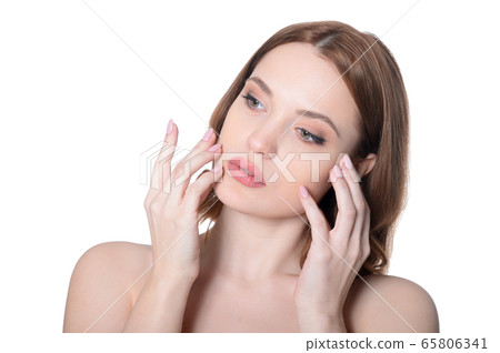 Portrait of beautiful young woman posing isolated on white background Portrait of beautiful young woman posing isolated on white background 65806341