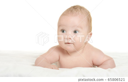Cute baby girl posing on white blanket at home 65806521