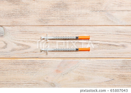 Top view of insulin syringe prepared for injection Top view of insulin syringe prepared for injection 65807043
