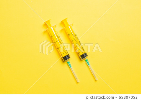 Top view of medical syringes on colorful Top view of medical syringes on colorful 65807052