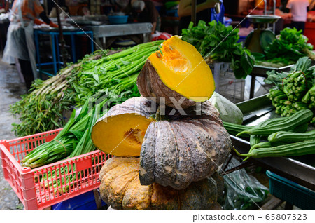 Yellow pumpkin with vegetable on a market at Bangkok 65807323