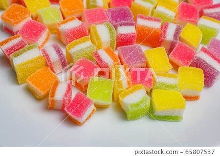 A pile of fruity gummy jelly sweets. 65807537