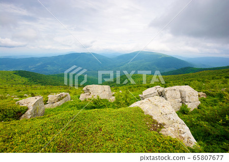 huge stones in valley on top of mountain ridge. huge stones in valley on top of mountain ridge. 65807677