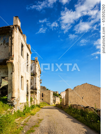 Ruined buildings of an abandoned city. 65808260