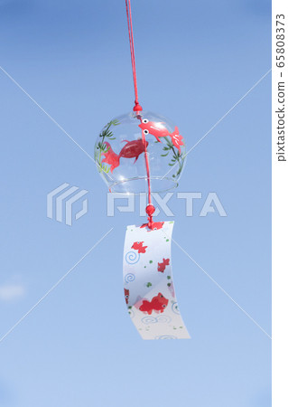 Goldfish wind chimes swaying against the blue sky Goldfish wind chimes swaying against the blue sky 65808373