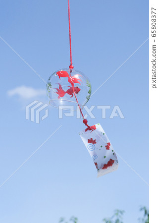 Goldfish wind chimes swaying against the blue sky 65808377