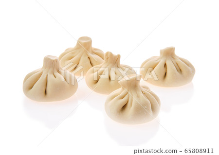 Uncooked khinkali isolated on white background Uncooked khinkali isolated on white background 65808911