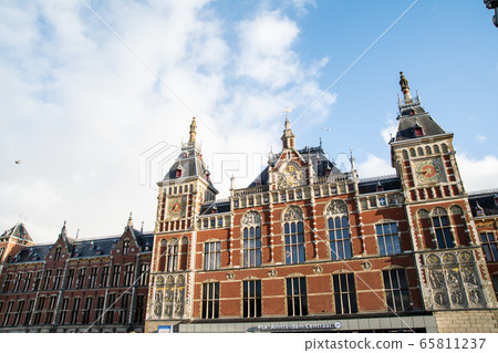 Red brick historic Amsterdam central station in the Netherlands Red brick historic Amsterdam central station in the Netherlands 65811237