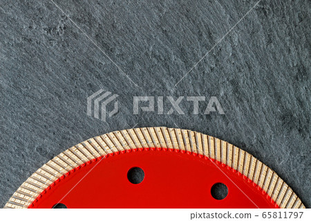 A segment of a red diamond blade for cutting 65811797