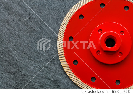 Red cutting diamond blade on a gray granite 65811798