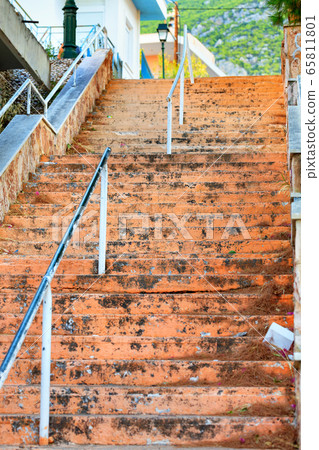 Old stone staircase with weathered shabby steps Old stone staircase with weathered shabby steps 65811801