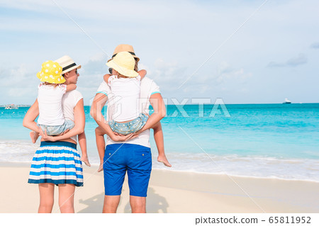 Photo of happy family having fun on the beach. Summer Lifestyle 65811952