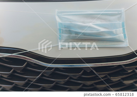 The medical mask in the car, virus concept. The medical mask in the car, virus concept. 65812318