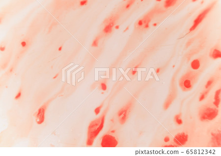 Fresh red blood splat on white porcelain with specks from the impact. Copy space area for horror themed concepts and ideas. macro 65812342