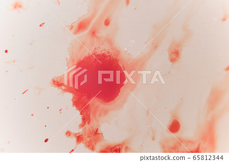 Fresh red blood splat on white porcelain with specks from the impact. Copy space area for horror themed concepts and ideas. macro 65812344