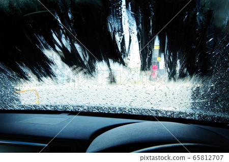 View the car wash machine in operation from inside the car 65812707