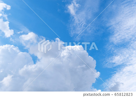 Bright pop blue sky with white clouds 65812823