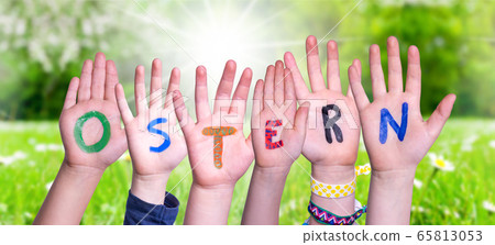 Children Hands Building Word Ostern Means Easter, 65813053