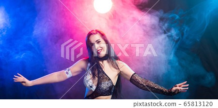 Close-up of woman in oriental costume performing belly dance. Tribal fusion dance concept. 65813120