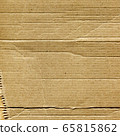 Closeup of brown cardboard texture. Dark rough vintage paper. Closeup of brown cardboard texture. Dark rough vintage paper. 65815862