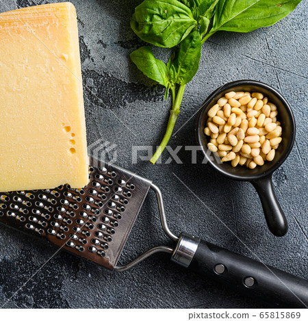 pine nuts and parmesan basil leaves for pesto genovese sauce Traditional Italian cuisine. Top view. close up 65815869