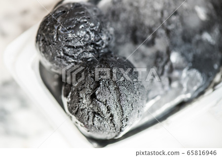 Scoops of Homemade Black Charcoal Coconut Ice Cream Scoops of Homemade Black Charcoal Coconut Ice Cream 65816946