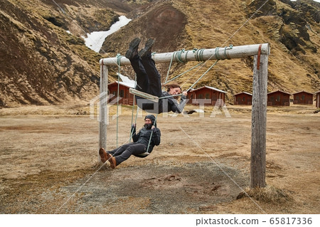 Using swings in Iceland 65817336