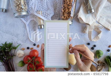 woman list on the note for vegan health food and woman list on the note for vegan health food and 65817798