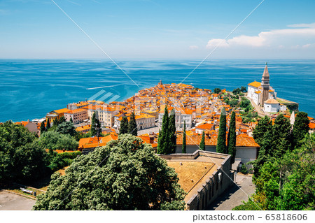 Panoramic view of Piran old town and Adriatic sea with St. George's Parish Church in Slovenia Panoramic view of Piran old town and Adriatic sea with St. George's Parish Church in Slovenia 65818606
