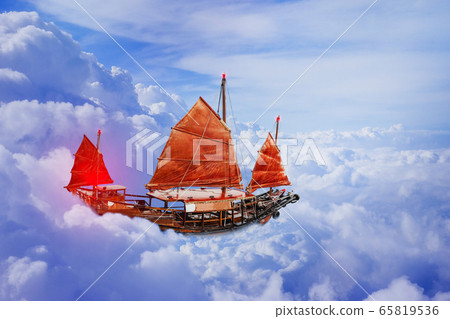 Sailboat red flag on blue sky heaven Sailboat red flag on blue sky heaven 65819536