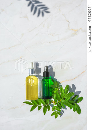 Serum with herbal extracts for skincare. Flat Lay minimalism 65820924