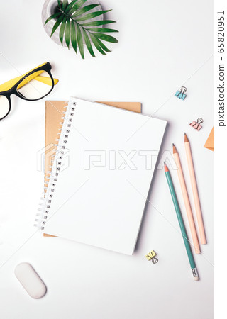 Freelancer workplace top view. Stay at home, work and study online. Notepad, stationery. Light background, flat lay Freelancer workplace top view. Stay at home, work and study online. Notepad, stationery. Light background, flat lay 65820951