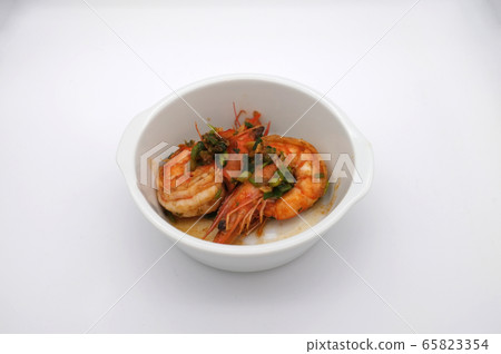 Fried shrimp with garlic on white background Fried shrimp with garlic on white background 65823354