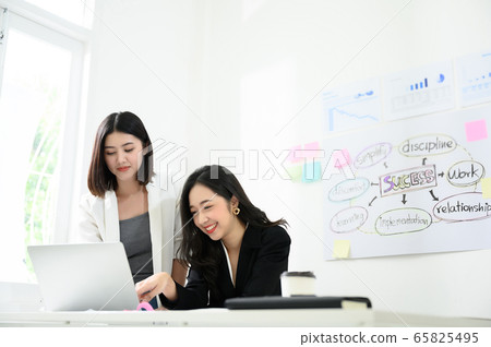 Two beautiful young asian business woman people have fun and talking Two beautiful young asian business woman people have fun and talking 65825495