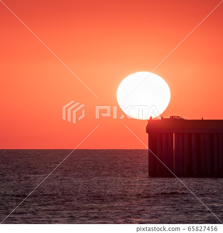 Beautiful red and orange sunset over the sea. Beautiful red and orange sunset over the sea. 65827456