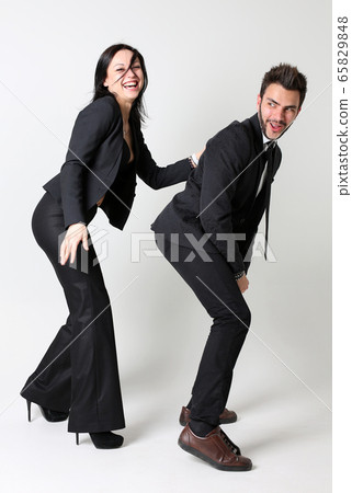 Fashion man and woman. The concept of female domination Fashion man and woman. The concept of female domination 65829848