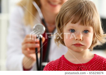 Little child with stethoscope at doctor reception Little child with stethoscope at doctor reception 65829874